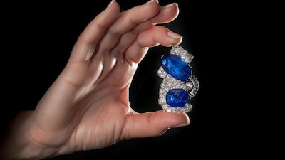 The largest Kashmir sapphire ever to appear at auction is viewed ahead of the Sotheby's sale in Geneva. Getty Images