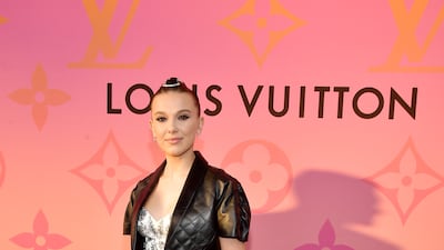 Millie Bobby Brown, wearing a pink peplum skirt and cropped leather jacket by Louis Vuitton, attends a cocktail party hosted by the French fashion in Beverly Hills on June 27, 2019. Getty Images