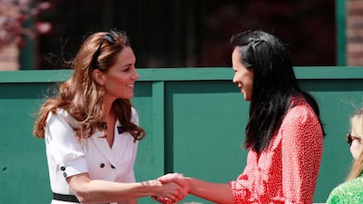 Kate Middleton, Duchess of Cambridge, shakes hands with former British tennis player Anne Keothavong. Reuters