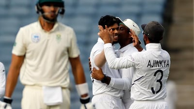 India bowler Umesh Yadav, without cap, celebrates after dismissing South Africa's Aiden Markram. AP