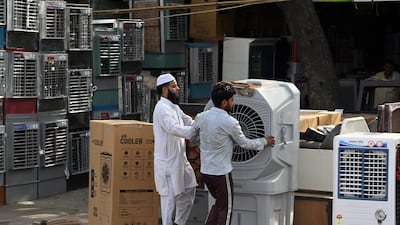 Air coolers for sale in New Delhi. Record demand for water and electricity has created shortages in parts of the city. Bloomberg