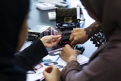 UAE high school pupils conduct experiments during the programme. Victor Besa / The National