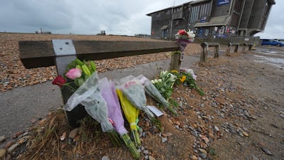 Floral tributes on the beach at Shoreham-by-Sea, West Sussex, near the RNLI station. Getty Images
