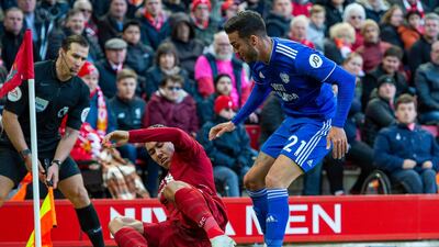 Liverpool's Roberto Firmino plays a back heal past Cardiff City's Victor Camarasa. EPA