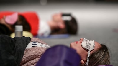 A sound-healing experience, which is a holistic approach to healing and a form of therapy for relaxation, at Manarat, Abu Dhabi. Khushnum Bhandari / The National