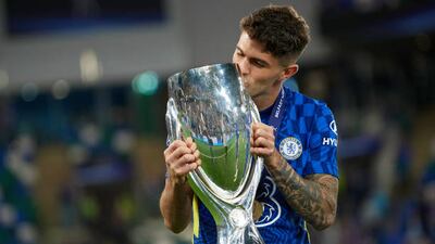 Christian Pulisic of Chelsea kisses the trophy.
