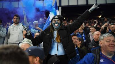 Everton fans celebrate following the win. Getty