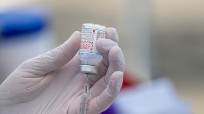 A Moderna Covid-19 vaccine being prepared for use at a site in California. More than 698 million vaccines have been distributed to fight the pandemic, according to Bloomberg's Vaccine Tracker. Bloomberg