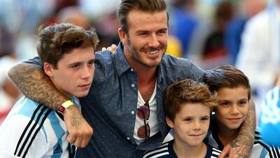Former England international David Beckham and sons Brooklyn Beckham, Cruz Beckham and Romeo Beckham. Getty Images