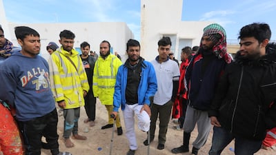 Rescued migrants rest at El Ketef after an aborted crossing of the Mediterranean.