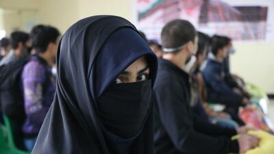 People wait to cross into Afghanistan from Iran at the border cross of Islam Qala between Afghanistan and Iran, in Herat, Afghanistan. EPA