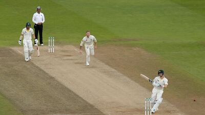 Australia batsman Steve Smith is struck on the helmet by a delivery from England all-rounder Ben Stokes on Saturday. Ryan Pierse / Getty Images