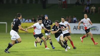 The UAE's Ray Gilburt runs with the ball during a Test match against Singapore at The Sevens in Dubai on April 23, 2014. Sarah Dea / The National