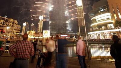 People celebrate to the fireworks display. Ali Haider/ EPA
