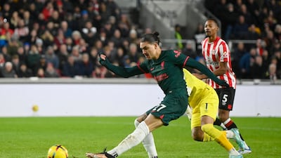 Liverpool striker Darwin Nunez rounds Bees goalkeeper David Raya but is denied a goal by a goal-line clearance by Men Mee. Reuters
