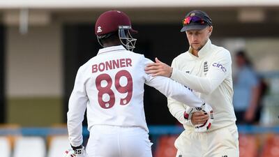 England captain Joe Root and West Indies batter Nkrumah Bonner shake hands after the drawn first Test in Antigua. AFP