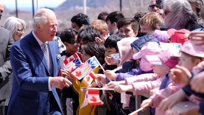 Prince Charles is greeted by well-wishers in St John's. AP