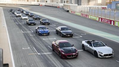 DUBAI, UNITED ARAB EMIRATES. 25 October 2017. Maserati Owners Club meet up event at the Dubai Autodrome. Cars line up on the track for a photo-op. (Photo: Antonie Robertson/The Nationa