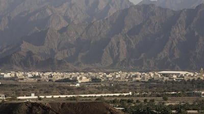 The spectacular Hajjar mountain range, which stretches for 500km, looms high over Hatta. Jeff Topping / The National