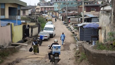 Moses Udoh, an employee of online retailer Jumia, makes a delivery by motorcycle in Lagos. Joe Penney / Reuters
