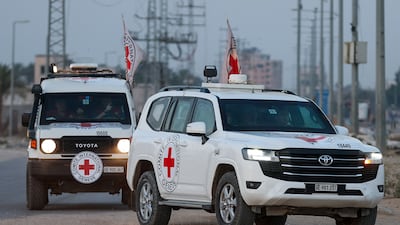 Red Cross vehicles transport the bodies of two hostages handed over by Hamas on Thursday as part of a ceasefire deal. Reuters