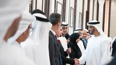 Sheikh Mohamed bin Zayed greets the to top performing pupils of Grade 12 during a meeting at Al Bateen Palace. Mohamed Al Hammadi / Ministry of Presidential Affairs