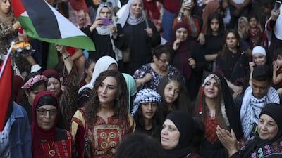 Women in the West Bank city of Ramallah celebrate Traditional Dress Day, an annual heritage event representing Palestinian costume, crafts such as embroidery, and song. AFP