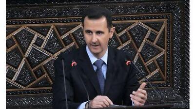 Syrian president Bashar al Assad addresses the nation during a speech to parliament in Damascus yesterday in which he blamed the wave of protests against his authoritarian rule on 'conspirators' and failed to offer any concessions to appease the wave of dissent.