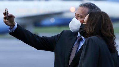 Singapore's Foreign Minister Vivian Balakrishnan takes a selfie with US Vice President Kamala Harris. AFP