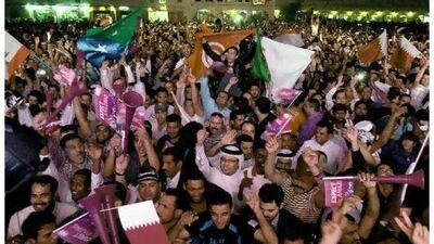 Doha residents take to the streets last night to celebrate the announcement that the 2022 World Cup will be hosted by Qatar. Marwan Naamani / AFP