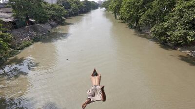 A man jumps into Tolly’s Nullah to cool off on a hot day in Kolkata, India. Rupak De Chowdhuri / Reuters