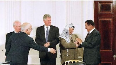 Hosni Mubarak shakes hands with the PLO leader, Yasser Arafat, in Washington in 1995, as the US president, Bill Clinton, centre, King Hussein of Jordan, fourth from right, and the Israeli prime minister, Yitzhak Rabin, look on.