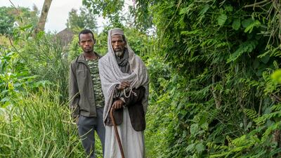 Mr Mukhtar with his son Fouwad, who has taken over farming and supporting the family after his father became ill. Photo: End Fund