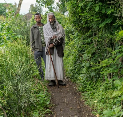 Lelamo Mukhtar with his son Fouwad, who has taken over farming and supporting the family after his father became ill with lymphatic filariasis. Photo: End Fund