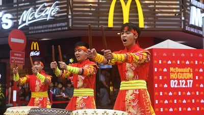 Performers beat drums during the opening ceremony of the first McDonald's restaurant in the Vietnamese capital, Hanoi, on December 2, 2017. Hoang Dinh Nam / AFP