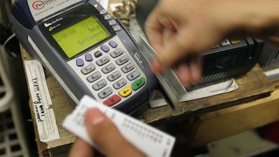 US credit card debt hit US$1.02 tn in June, according to the US Federal Reserve. Tim Boyle / Getty Images