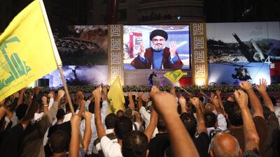 Lebanon's Hizbollah leader Hassan Nasrallah addresses supporters through a giant screen during a rally in Beirut. Khalil Hassan / Reuters