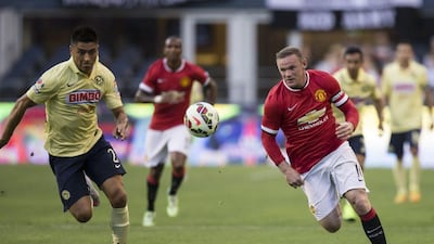 Wayne Rooney shown chasing the ball against Mexico's Club America on Friday in a pre-season friendly in Seattle. Stephen Brashear / AFP / July 17, 2015