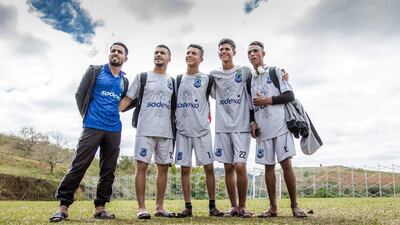 From left: Jawdat (the coach), Ahmad, Omar, Qais, Hafeth (nicknamed 'Marcelo') on the pitch in Brazil. Courtesy The Black Pearls Academy