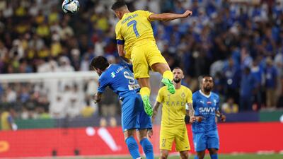 Cristiano Ronaldo of Al Nassr wins a header against Ruben Neves of Al Hilal. EPA