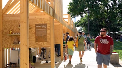 Visitors tour the outdoor kiosks.
