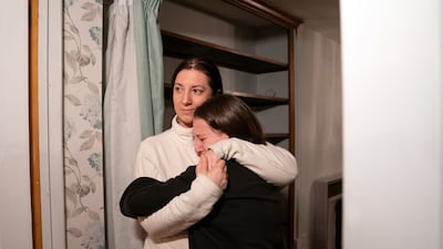 Valeriia Starkova hugs her daughter Kamila.