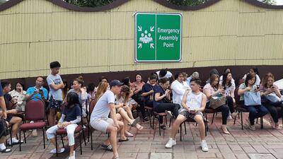 epa07961974 Hotel guests gather in front of a hotel building in the aftermath of a 6.5 magnitude earthquake, in Davao city, Philippines, 31 October 2019. According to the United States Geological Survey (USGS), a 6.5 magnitude earthquake occurred at a depth of 10km near Bulatukan, Cotabato province, on 31 October. It is the third strong earthquake the area has experienced this month. EPA/MIKE S. MARIANO