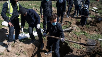 The Rapid Response Division of the Raqa civil defence excavate the site of a mass grave near the northern Syrian city of Raqa on February 19, 2019. Fadel Senna / AFP