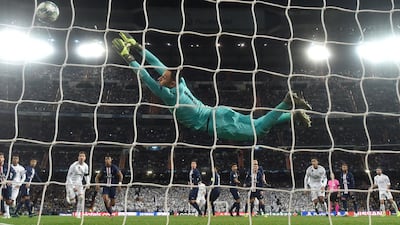 Keylor Navas of PSG reaches for the ball as Gareth Bale of Real Madrid hits the post from a freekick. Getty