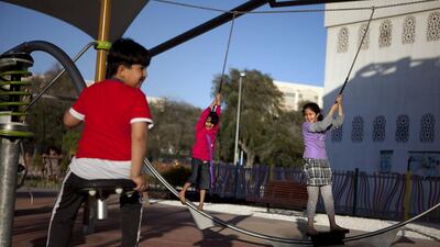 Children at play in a children's park in Al Bateen, Abu Dhabi. Silvia Razgova / The National
