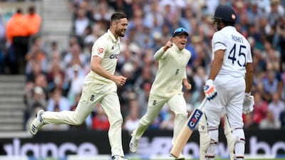 England bowler celebrates Chris Woakes dismissing Rohit Sharma of India for 11. Getty