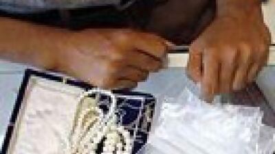A customer looks at gold jewellery at a showroom in Mumbai. India imported 257 tonnes of the yellow metal in the first quarter. Danish Siddiqui / Reuters