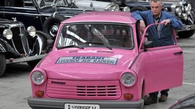 Juergen Poenisch stands next to the last Trabant, a 1.1er with four-stroke engine with 40hp of the car manufacturer Volkswagen, at the August Horch Museum in Zwickau, Germany, in April. EPA