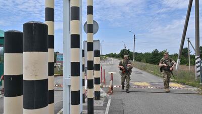 Ukrainian border guards patrol at the Slavutych checkpoint along the Ukrainian-Belarusian border in Chernihiv region. AFP